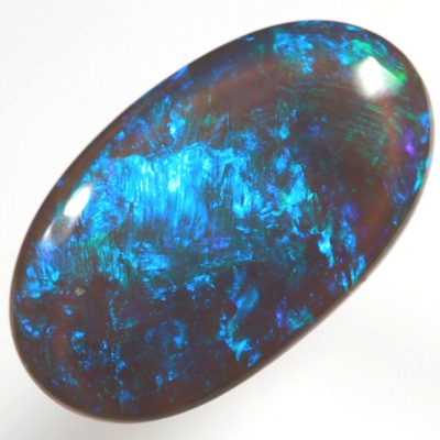 SOLID BLACK CRYSTAL OPAL Rolling flashes of green and turquoise purple fire